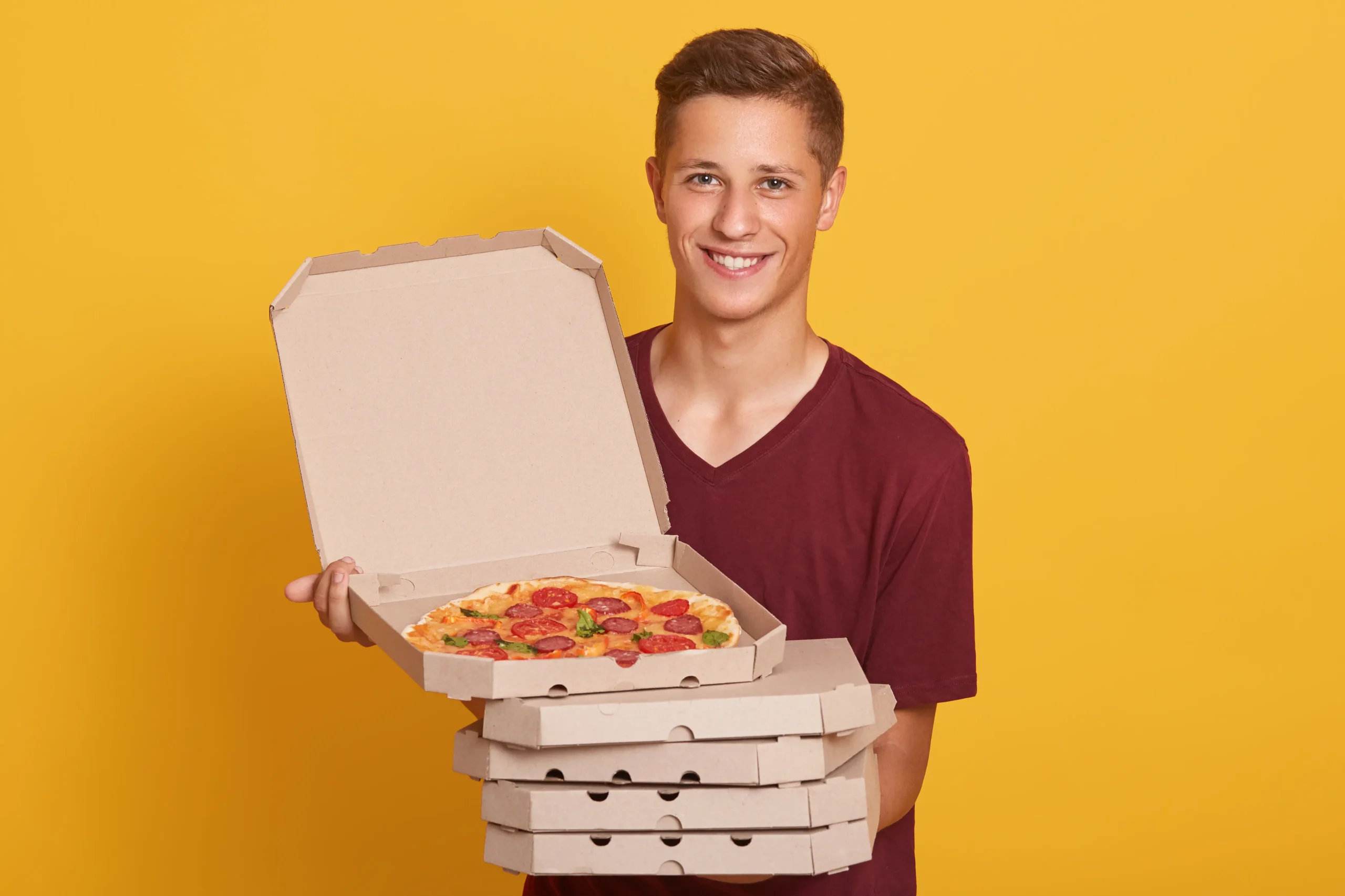 Custom packaging localization Canada demonstrated through standardized pizza boxes designed for local food service and delivery needs